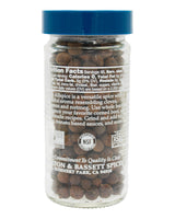 Jar of allspice with a blue lid on a white background