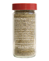 Spice jar with red lid and nutritional information label on a white background