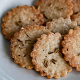 Close-up of crackers with seeds on a white plate