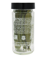 Glass jar with black lid containing green herbs, labeled 'Morton & Bassett Spices'.