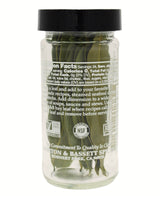 Jar of pickled green leaves with a black lid on a white background