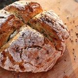 Loaf of bread on a wooden surface