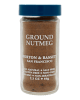 Glass jar of Morton & Bassett ground nutmeg with blue lid, labeled all-natural, gluten-free, non-GMO, 2.3 oz.