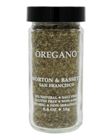 Glass jar of Morton & Bassett oregano, labeled all-natural, salt-free, gluten-free, non-GMO, 0.6 oz, San Francisco.
