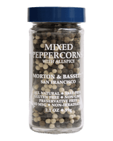 A clear glass spice jar filled with mixed peppercorns and allspice, topped with a dark blue lid. White text on the front reads 'MIXED PEPPERCORN WITH ALLSPICE' and 'MORTON & BASSETT SAN FRANCISCO.
