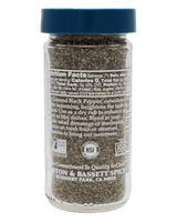 A clear plastic spice jar filled with ground black pepper, featuring a dark blue screw cap and a white label with text and certification logos, shown against a solid black background.