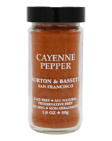 A 1.8 oz glass jar of Morton & Bassett Cayenne Pepper seasoning against a solid black background.