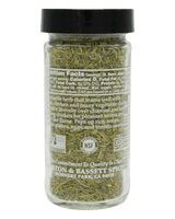 A clear plastic spice jar filled with dried green herb pieces, topped with a black lid, shown against a solid black background. The front label is turned sideways and displays nutrition facts and branding for 'Citron & Bassett Spices'.