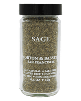 A clear glass spice jar filled with dried sage herb, sealed with a black lid, and labeled 'SAGE' with 'Morton & Bassett San Francisco' on a black background.