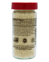 A clear plastic spice jar filled with light beige salt crystals, topped with a red cap, shown against a solid black background. The back of the label is visible, showing nutrition facts and certification logos, with the brand name 'Morton & Bassett Spices' printed at the bottom.