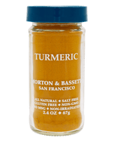 A clear glass jar of Morton & Bassett Turmeric spice powder with a blue screw-top lid
