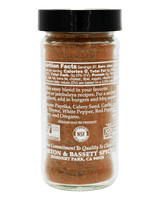 A bottle of Morton & Bassett Spiced Seasoning with a black cap, showing the back of the label with nutrition facts and NSF certification