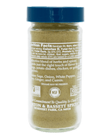 A bottle of Romaine Park & Bassett Spices herb and spice blend, showing the back of the label with nutrition facts and certifications, topped with a blue cap 