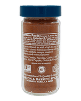 A bottle of Morton & Bassett Spices seasoned ground beef seasoning, featuring a blue cap and a clear container showing the brown seasoning inside