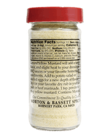 A clear plastic spice bottle with a red cap, showing the back of the label with nutrition facts and Morton & Bassett Spices branding