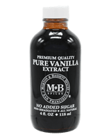 A bottle of M&B Pure Vanilla Extract against a solid black background. The bottle is dark amber glass with a white cap 