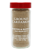 A clear glass jar of Morton & Bassett Ground Cardamom with a bright red lid, filled with brown ground spice